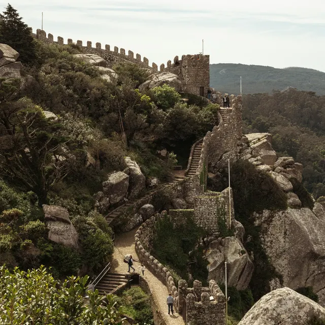The battlements of the Castelo dos Mouros stepping over granite boulders along the Sintra ridge